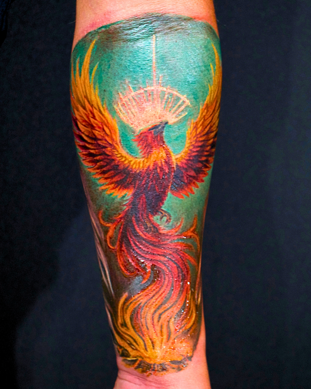 Rising phoenix, color realism forearm